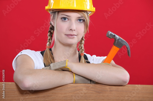 Photo: woman holding a hammer woman holding a hammer