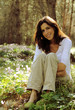 Foto: Beautiful 35 years old woman in spring forest Beautiful 35 years old woman in spring forest