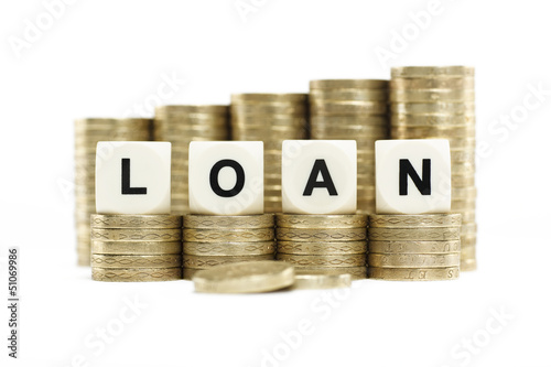 Photo: LOAN on gold coins on white background LOAN on gold coins on white background