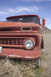 Old rusty truck in the desert with blue skies