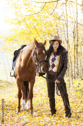 Photo: equestrian with her horse in autumnal nature equestrian with her horse in autumnal nature