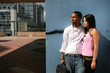 Couple stood by wall