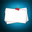 vector blue background with a stack of paper held together a pap