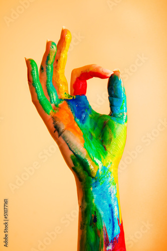Photo: Painted hand with OK sign, colorful fun. Painted hand with OK sign, colorful fun.