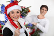 Couple decorating a Christmas tree