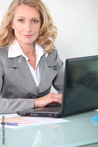 Photo: Businesswoman on laptop Businesswoman on laptop