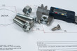Vernier caliper and assorted screw, nuts and bolts