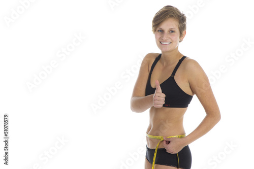Photo: Junge sportliche Frau mit Maßband in Unterwäsche Junge sportliche Frau mit Maßband in Unterwäsche