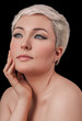 Face portrait of beautiful young woman isolated on black