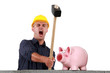 craftsman breaking a pig bank with a hammer