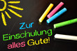Tafel mit bunter Kreide und Zur Einschulung alles Gute