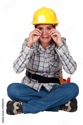Photo: A sobbing tradeswoman A sobbing tradeswoman