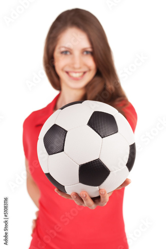 Photo: Girl holding a soccer ball in his outstretched hand Girl holding a soccer ball in his outstretched hand