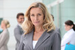 Woman standing in front of her colleagues