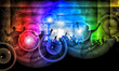 Silhouettes of concert crowd in front of bright stage lights