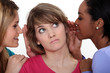 Three women gossiping.