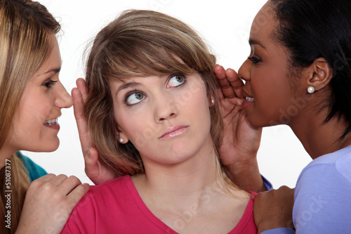 Photo: Three women gossiping. Three women gossiping.