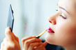 Photo: woman applying make-up woman applying make-up