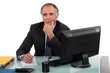 Pensive senior businessman has to make difficult decision