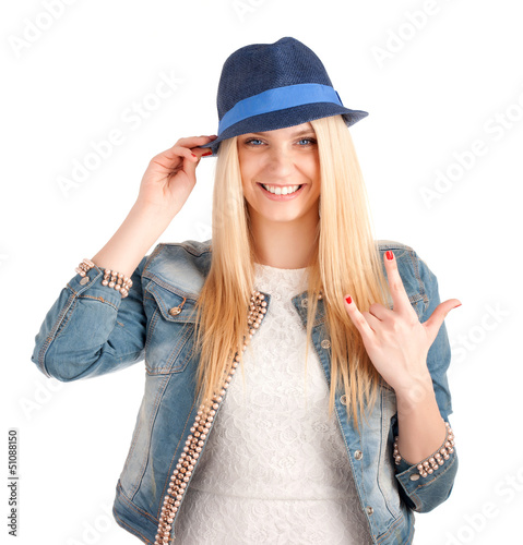 Photo: Portrait of young woman in blue hat Portrait of young woman in blue hat