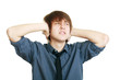 Man holding his hands up to his ears