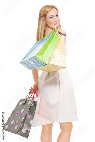 Photo: Portrait of an attractive young female holding shopping bags Portrait of an attractive young female holding shopping bags