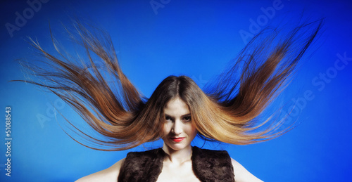 Photo: Fashion model with hair blowing in the wind Fashion model with hair blowing in the wind