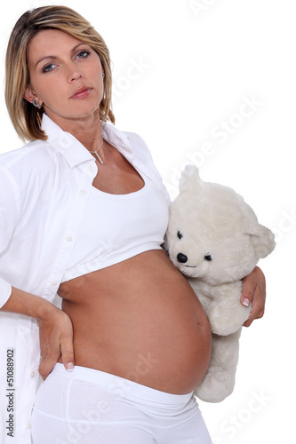 Photo: Pregnant woman with teddy bear Pregnant woman with teddy bear