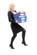 Full length portrait of a young professional woman holding folde