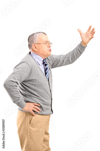 Photo: An angry mature man shouting An angry mature man shouting
