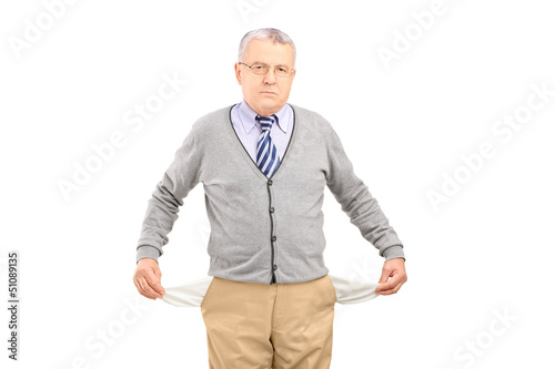 Photo: Senior man with empty pockets Senior man with empty pockets