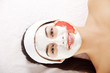 Attractive young woman with fruit mask