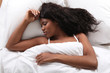 Young woman asleep in bed