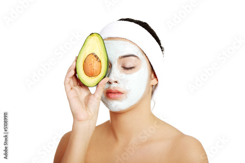 Photo: Young woman holding avocado Young woman holding avocado