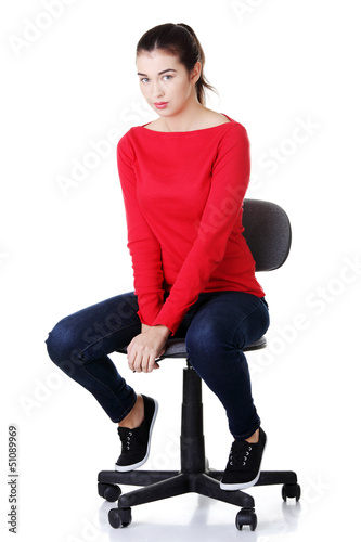 Photo: Young happy woman sitting on a wheel chair Young happy woman sitting on a wheel chair