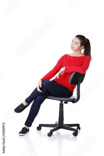 Photo: Young happy woman sitting on a wheel chair Young happy woman sitting on a wheel chair