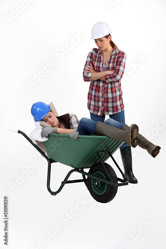 Photo: Construction worker discovering her colleague fast asleep Construction worker discovering her colleague fast asleep
