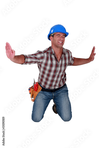 Photo: Man forcing invisible walls apart Man forcing invisible walls apart
