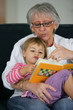 Photo: Grandma and child reading together Grandma and child reading together
