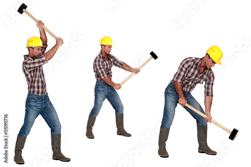 Photo: Tradesman laboriously using a mallet Tradesman laboriously using a mallet