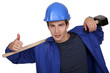 portrait of junior carpenter with hammer