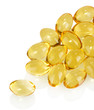 pellets of fish oil on white background close-up