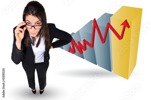 Photo: Businesswoman stood by bar chart Businesswoman stood by bar chart