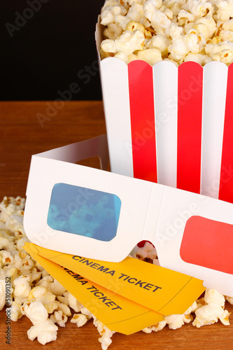 Photo: popcorn with tickets and cinema glasses popcorn with tickets and cinema glasses