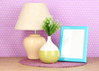 Photo: Colorful photo frame, lamp and flowers Colorful photo frame, lamp and flowers