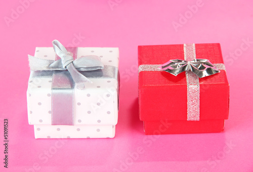 Photo: Color gift box with silver ribbon, on color background Color gift box with silver ribbon, on color background