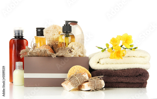 Photo: Composition of cosmetic bottles and soap in crate, isolated Composition of cosmetic bottles and soap in crate, isolated