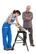 A carpenter and his trainee.