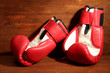 Boxing gloves on wooden background