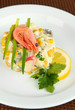 Small portion of food on big plate close up